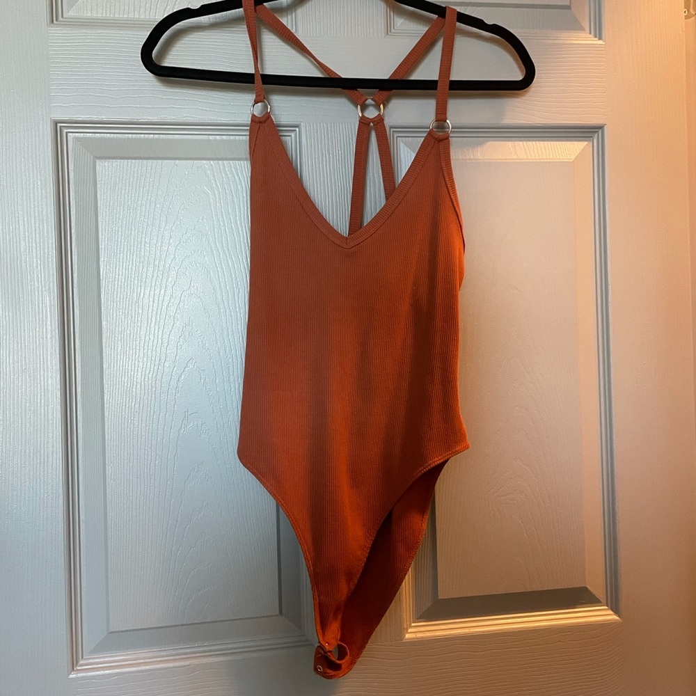 Burnt orange bodysuit from Forever 21. Size Medium.